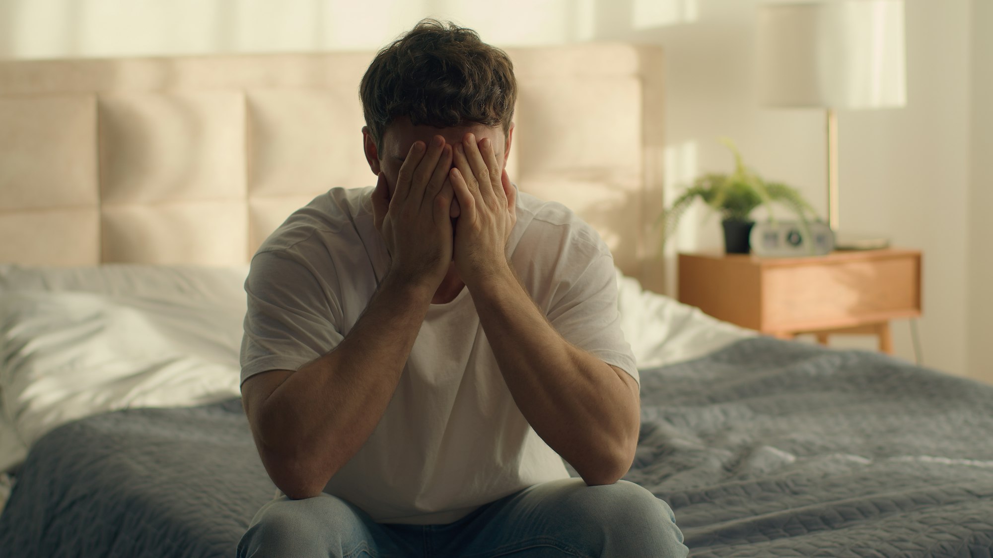 Caucasian man guy male throwing mobile phone smartphone bad news notification debt credit bankruptcy